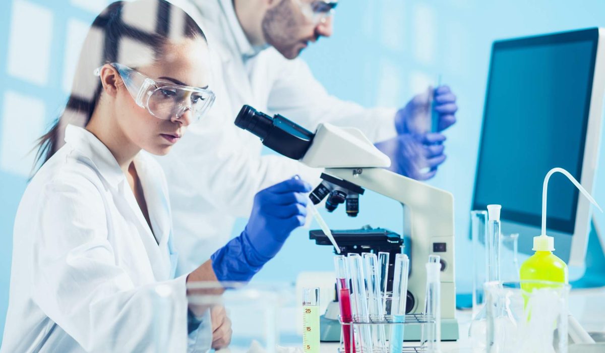 lab technician with glassware